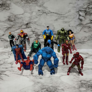 12 Marvel or DC Comics action figures